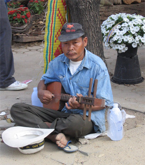 Street musician at Chiang Mai flower festival